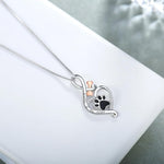 Lucky Paw necklace with heart, bone and infinity symbol